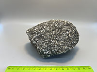 dark gray crystaline rocks with mall white and black crystals